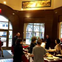 Alumni families getting food from the holiday buffet